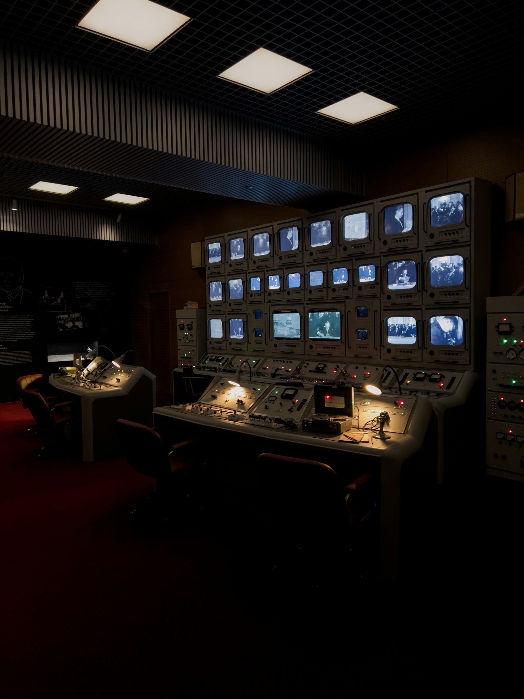 A modern incident command center with multiple monitors and ambient lighting, representing Atlassian's unified Service Collection.