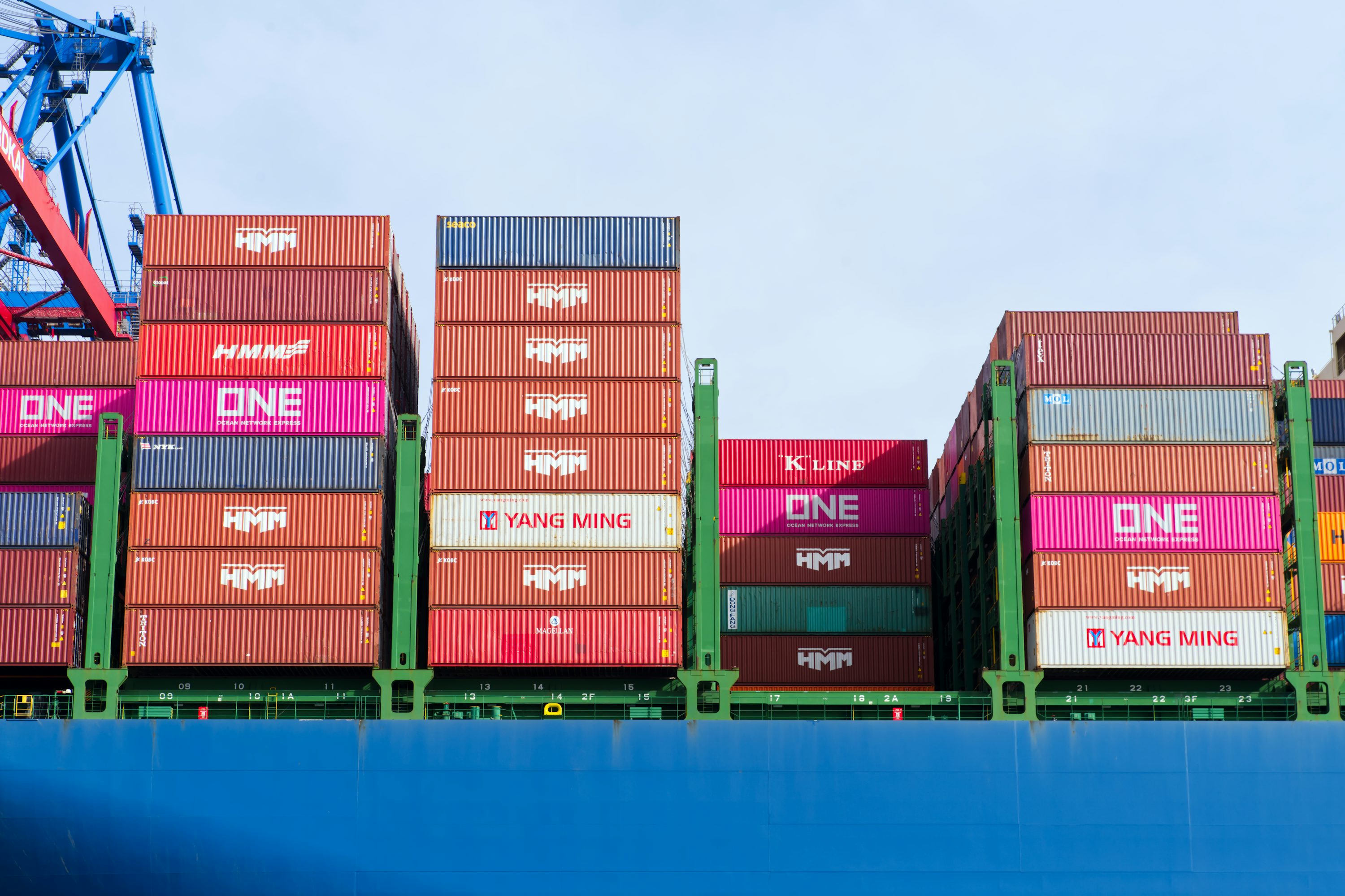 Stacks of shipping containers loaded on a cargo freighter