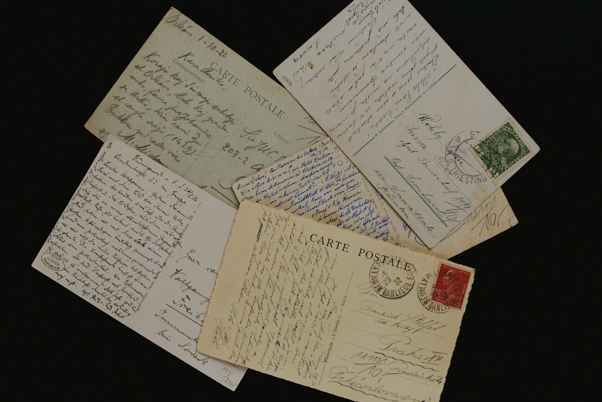 A stack of postmarked envelopes piled on a desk, standing in for Atlassian's Q4 FY26 shareholder letter and the product roadmap tucked inside it. Photo from Unsplash.