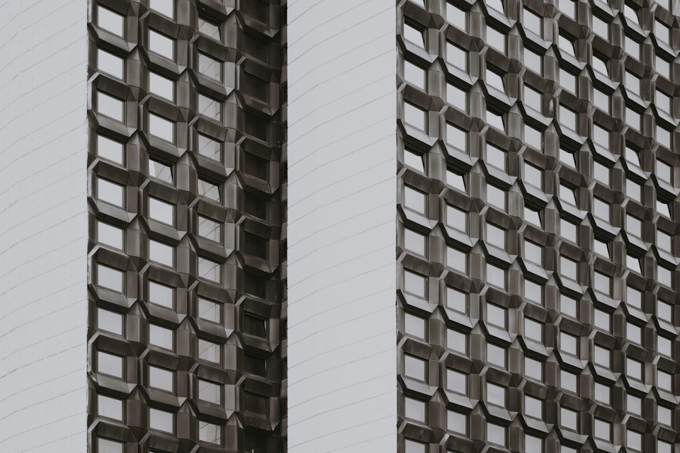Repeating geometric lines across a modern building facade