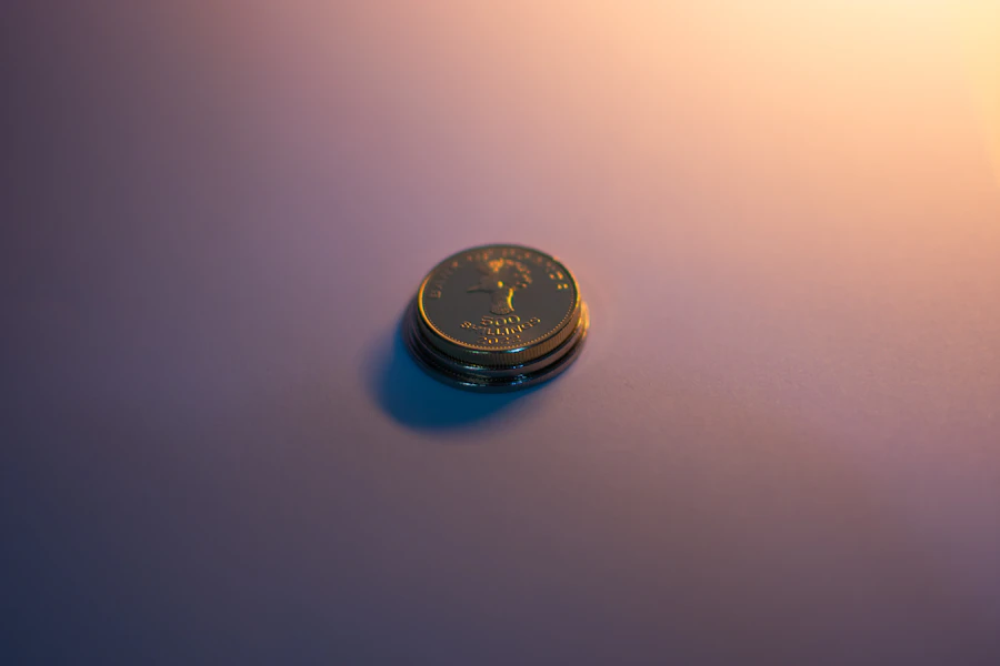 A small stack of coins on a plain surface