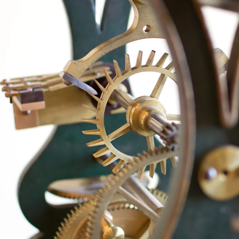 Interlocking brass gears inside a clock mechanism