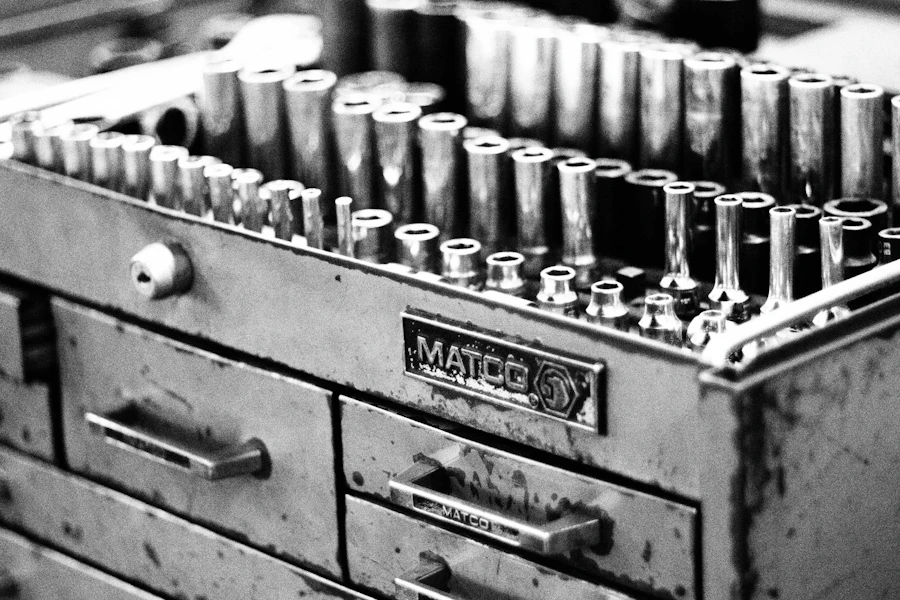 Hardware and small parts organized in a metal toolbox