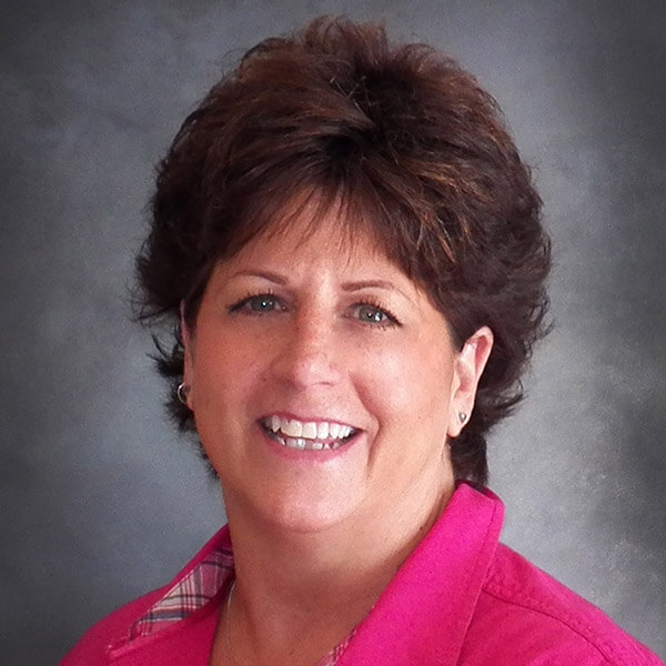 Smiling Systems Tech Consultant IT professional in pink top, professional headshot for Billings MT managed services team