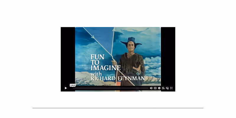 Video screen showing a person dressed in a costume with a hat and holding a staff, with the text 'FUN TO IMAGINE with RICHARD FEYNMAN' on a background of blue sky and clouds.