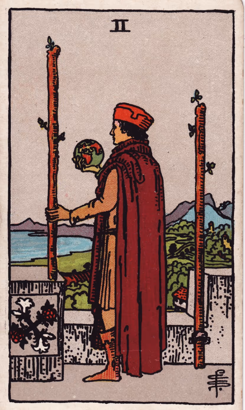 The Two of Wands tarot card from the Rider deck