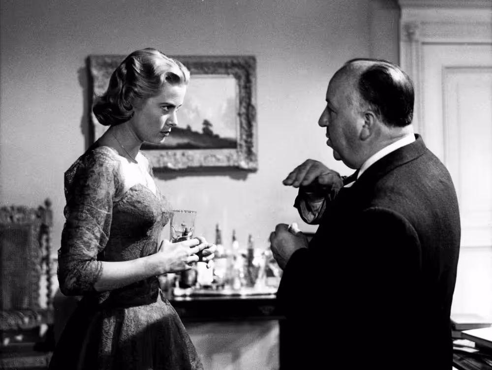 Hitchcock directing Grace Kelly during the filming of Dial M for Murder, 1954.