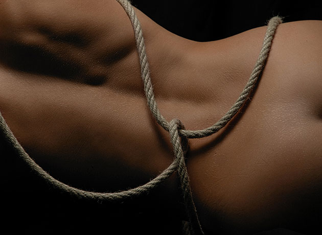 bare back and bottom tied with rope