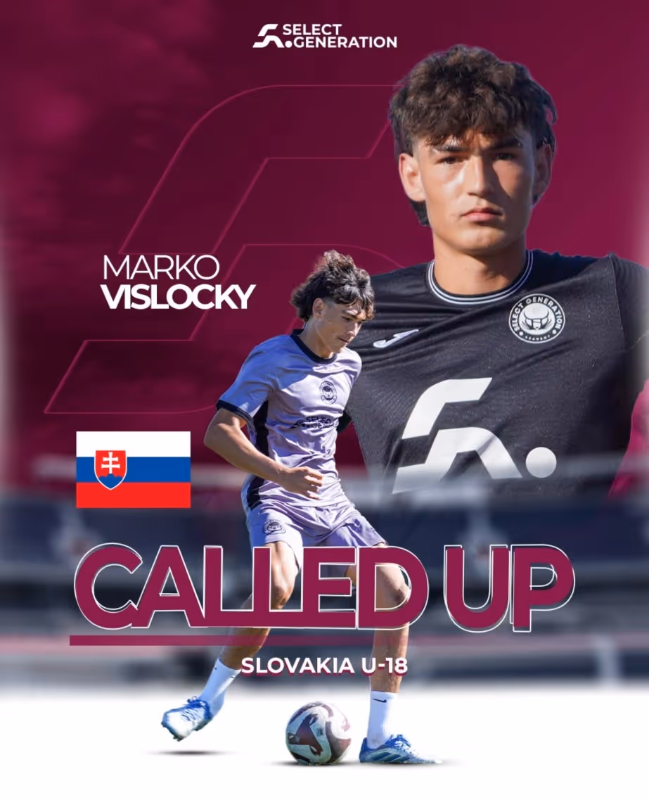 Two soccer players in maroon and white jerseys compete for the ball on a green field, with one player in a white and black jersey approaching.