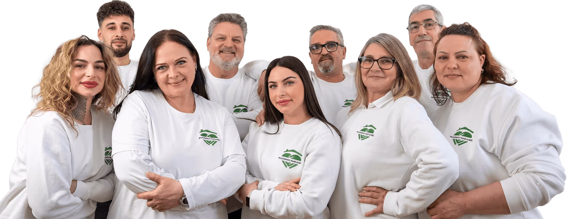 Das Hand- und Herz-Team steht eng beieinander und lächelt.