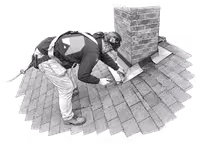Roofer inspecting chimney on shingled roof while wearing safety harness.