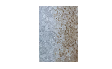 Close-up of a floral pattern transitioning from light blue and gray to brown and beige tones.