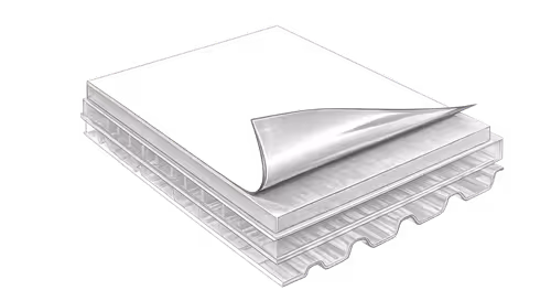 Stack of corrugated cardboard sheets with one sheet partially peeled back to show layers.