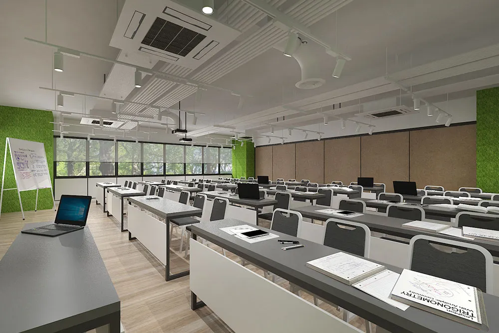The modern interior of Amazing Room, a private event space set up as a training room with desks, laptops, and a whiteboard.