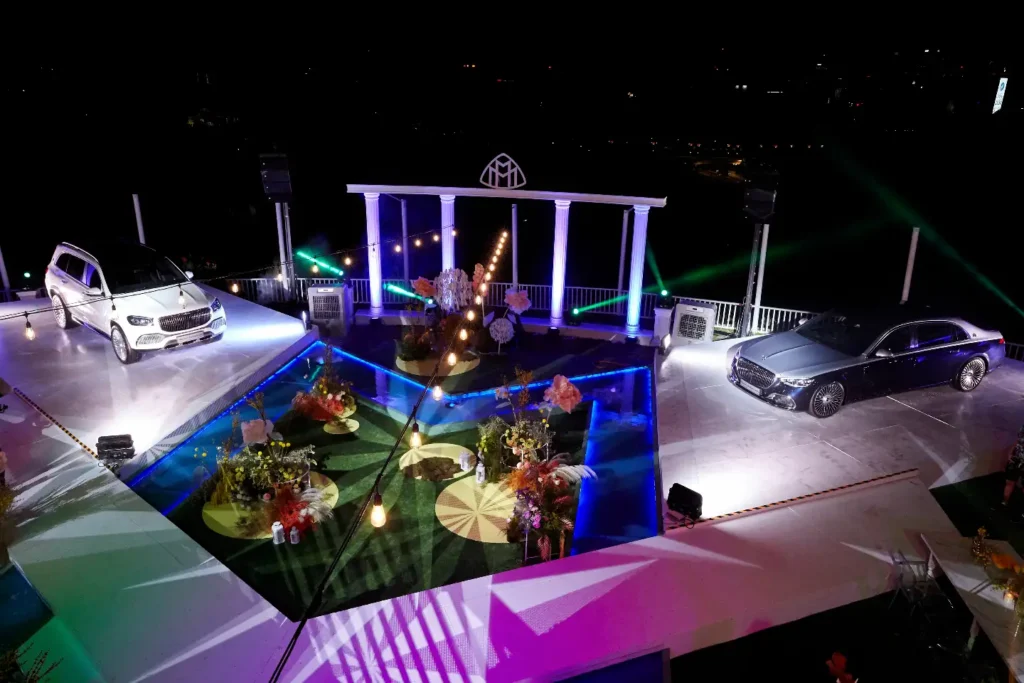 A nighttime Cherry car launch event on a lit rooftop at Whitehouse @ The Estate on Federal Hill.