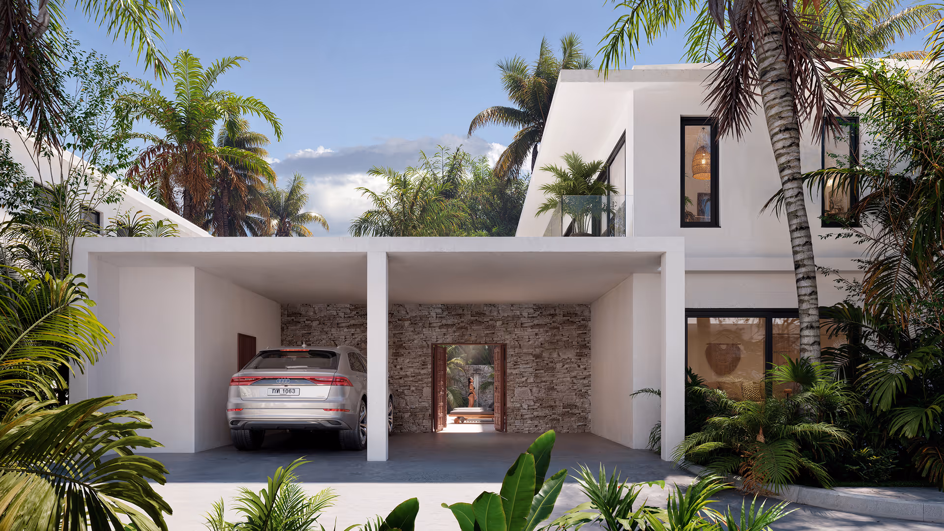 Modern white two-story house with a covered garage holding a silver Audi SUV, surrounded by lush tropical plants and palm trees.