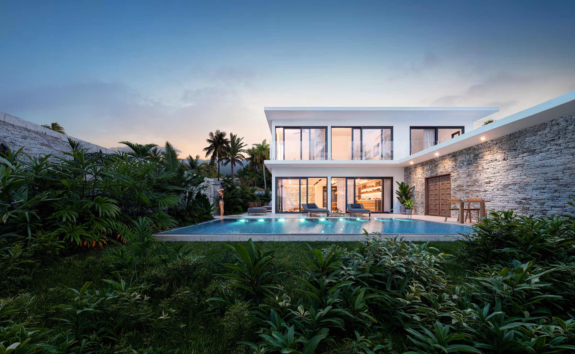 Modern two-story house with large glass windows, a lit swimming pool, and lush green plants at dusk.