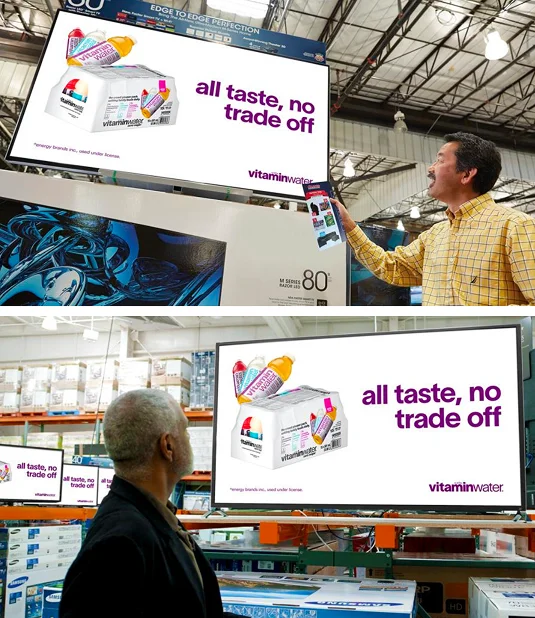 Vitaminwater retail media ads displayed on digital screens inside Costco warehouses