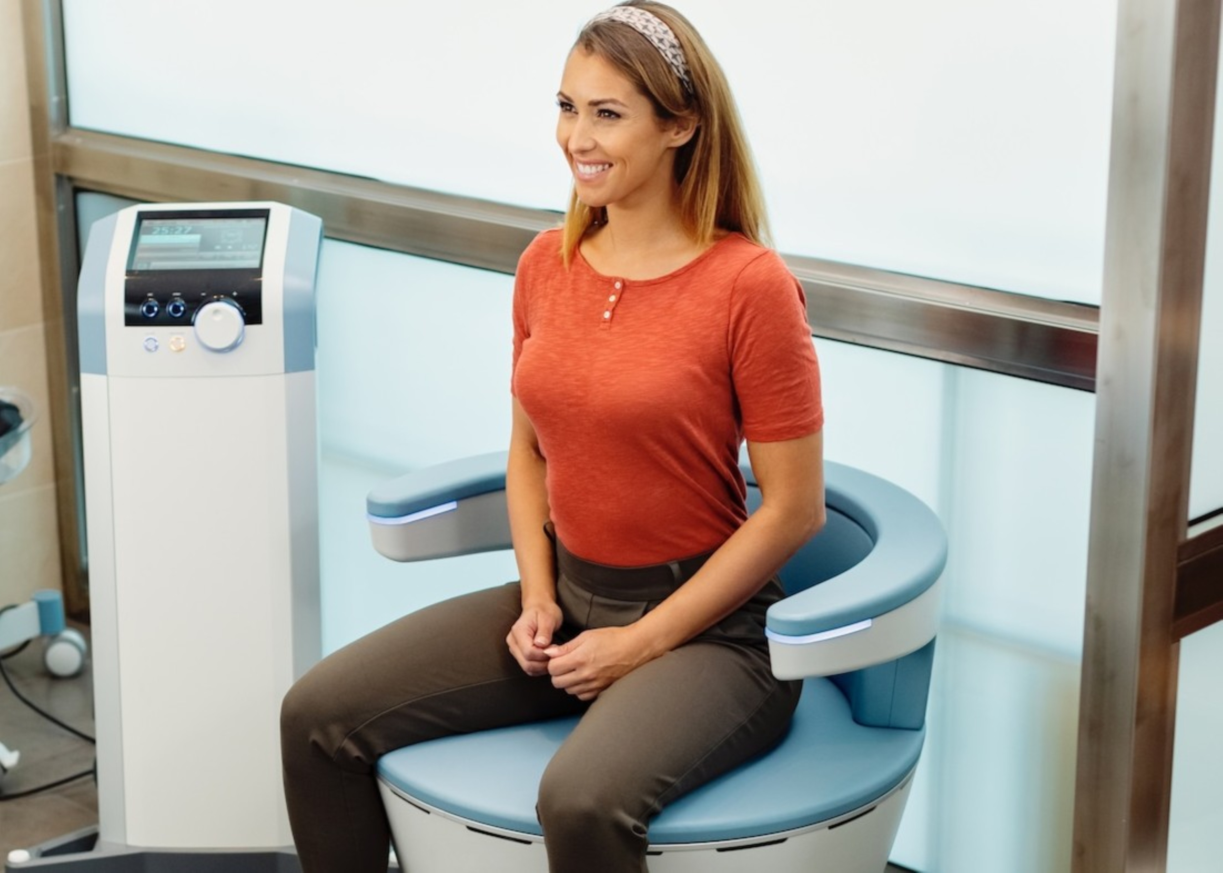 A woman using the Emsella device