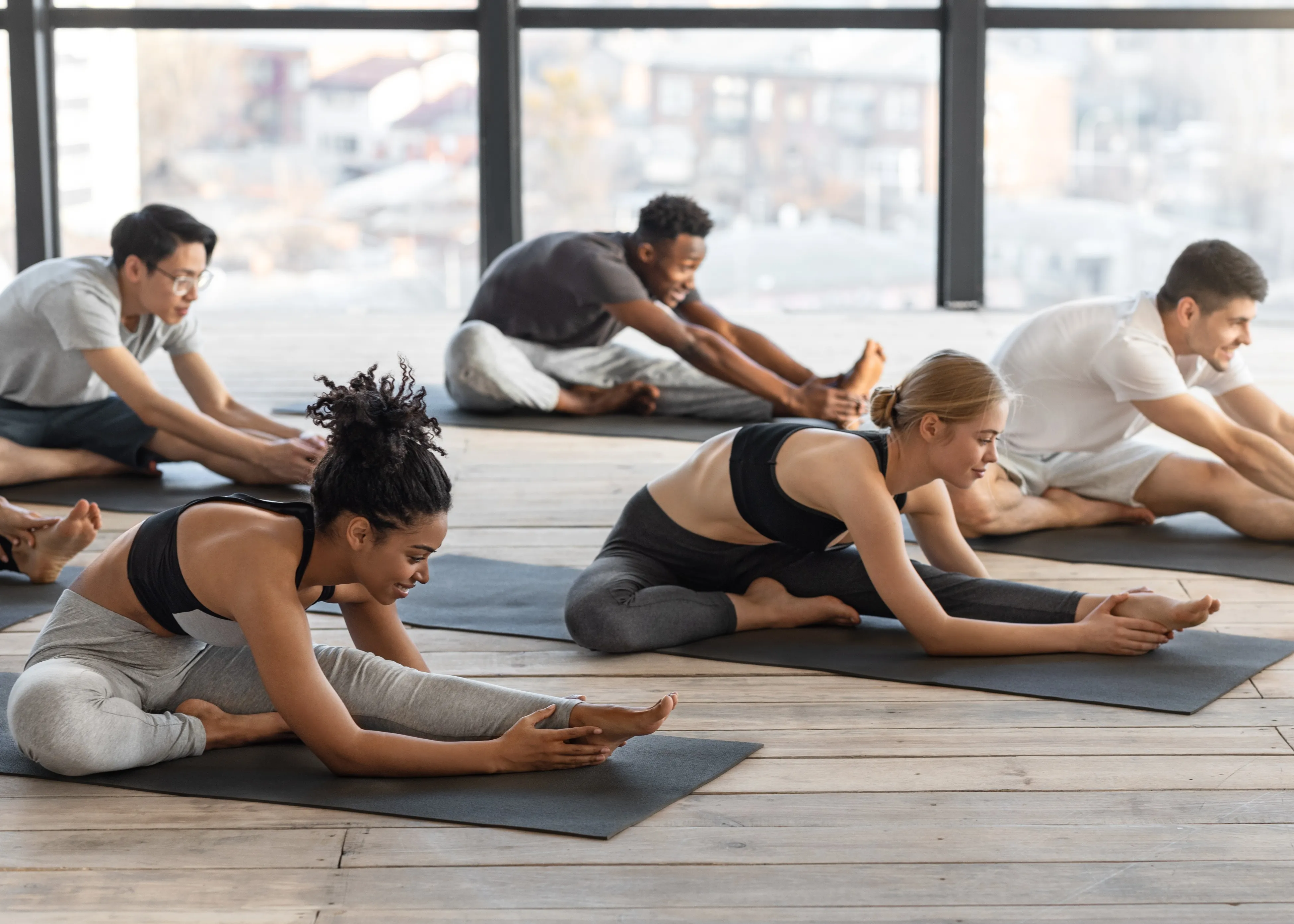 A group of people doing yoga