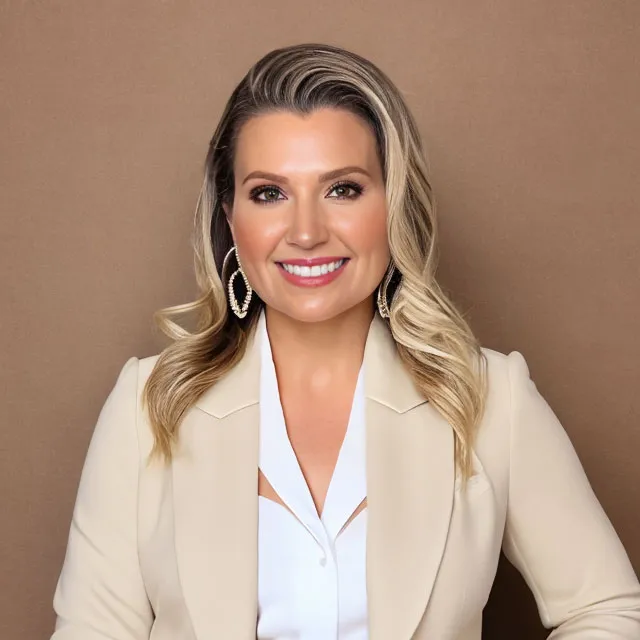 Dr. Edelstein-Snider, in a white shirt and a beige jacket.