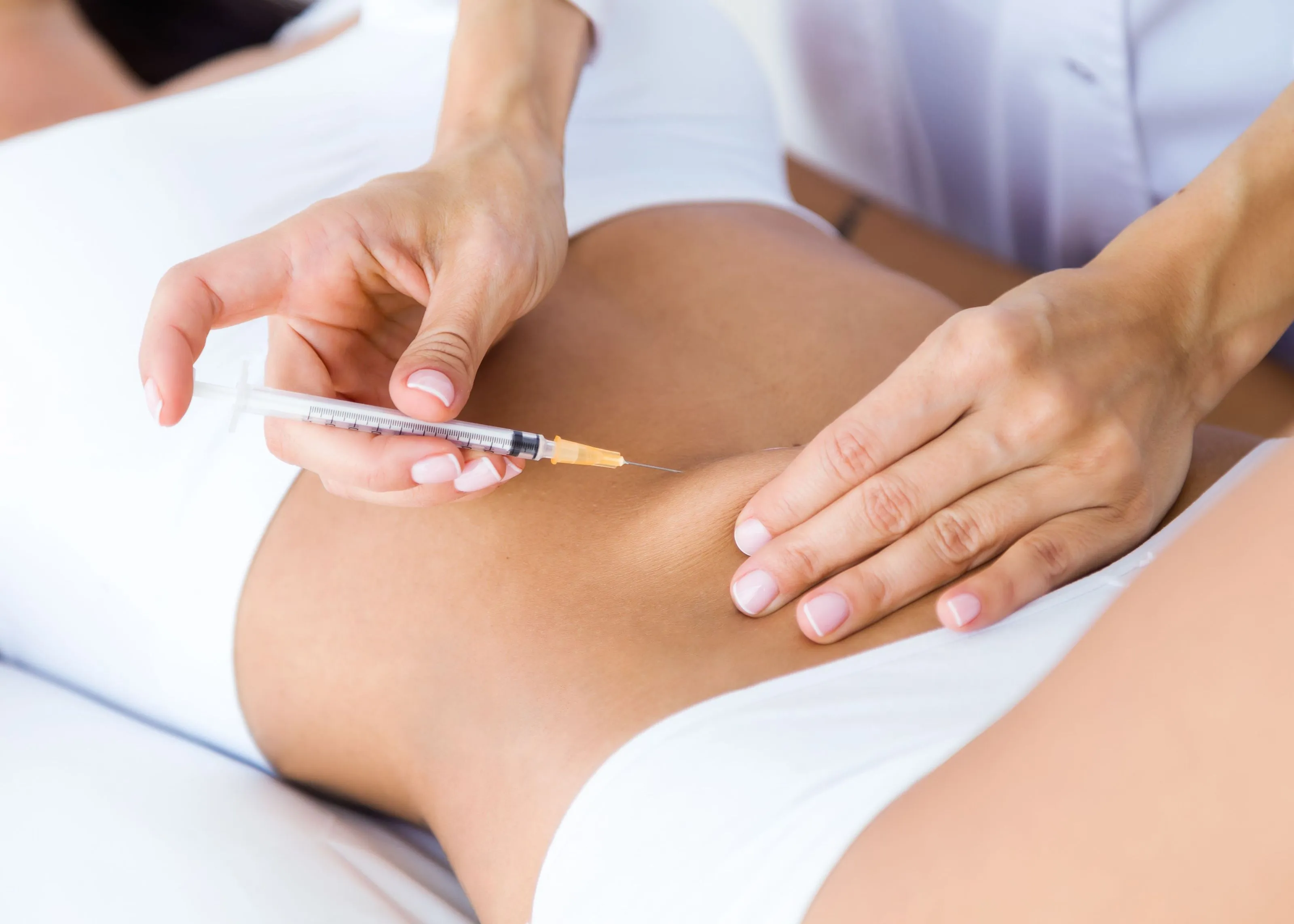 A woman getting a semaglutide injection.