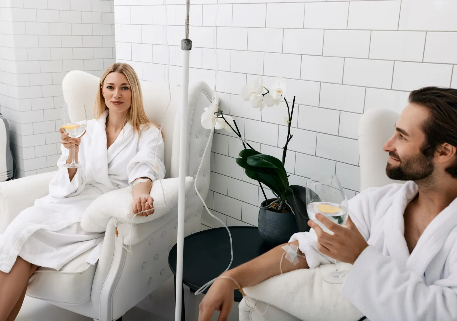 A man and a woman sitting in a spa room.
