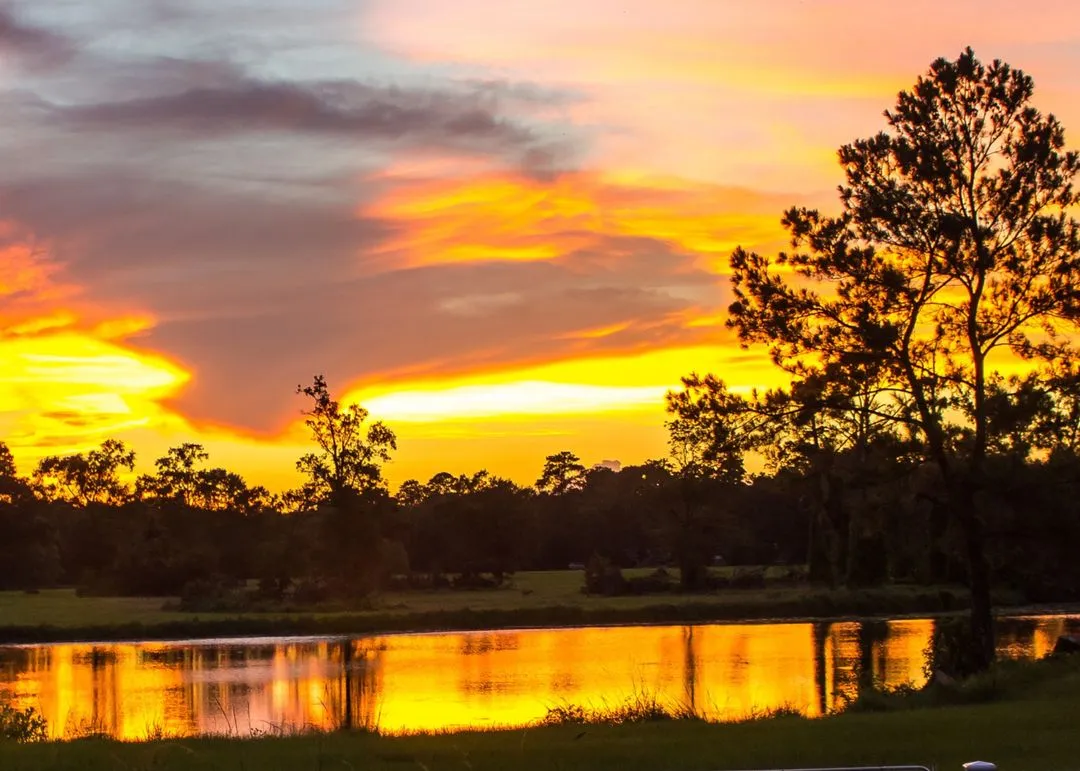A background of a lake with the sun setting