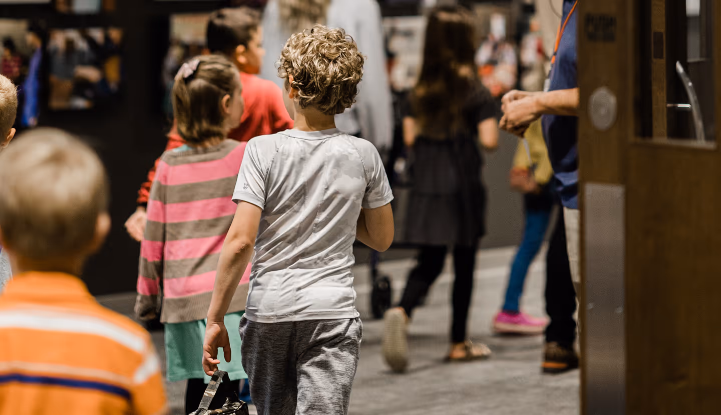 A group of children walking down a street.