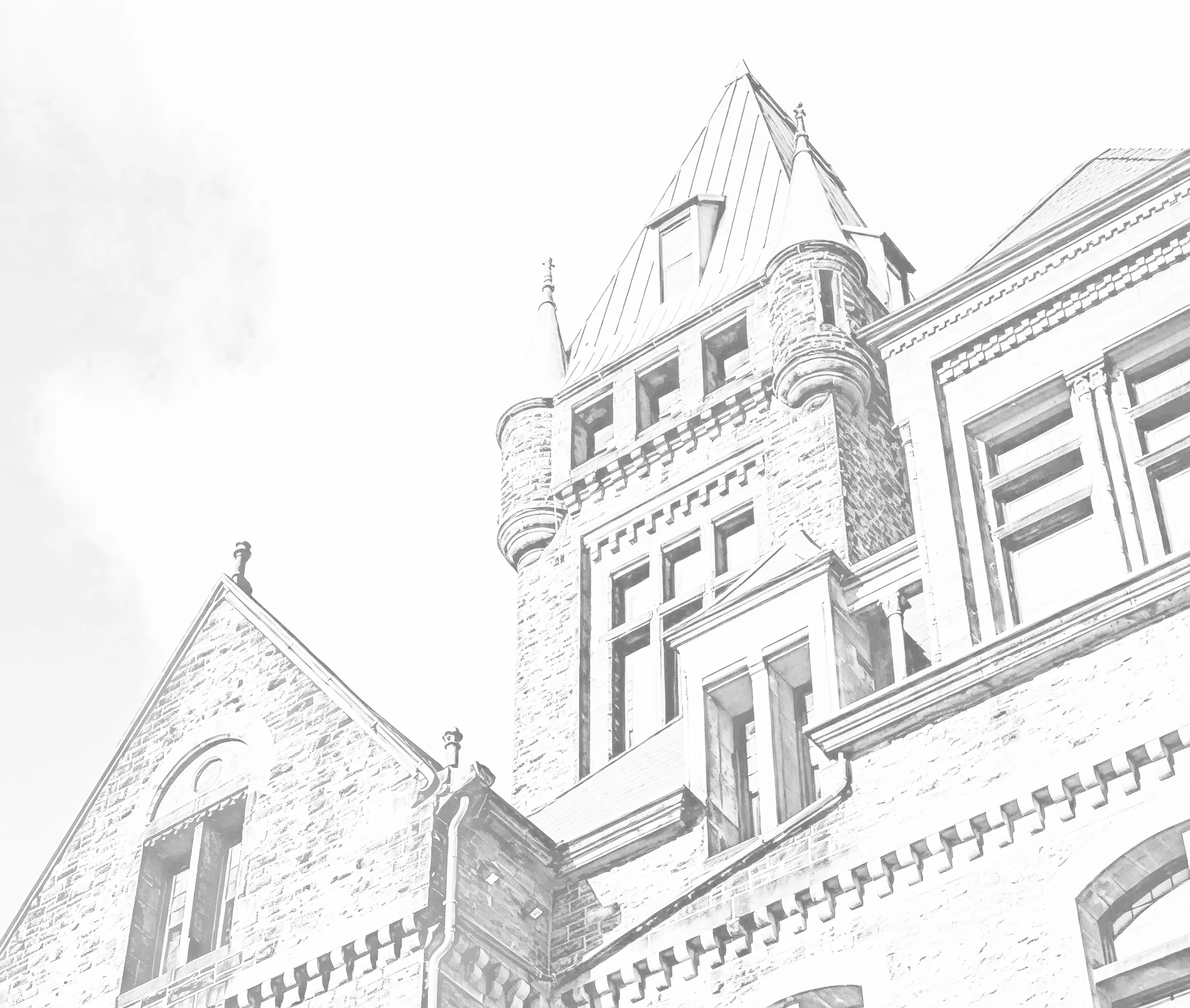 Richardson Olmsted Complex stone building with copper roof towers and multiple large windows.