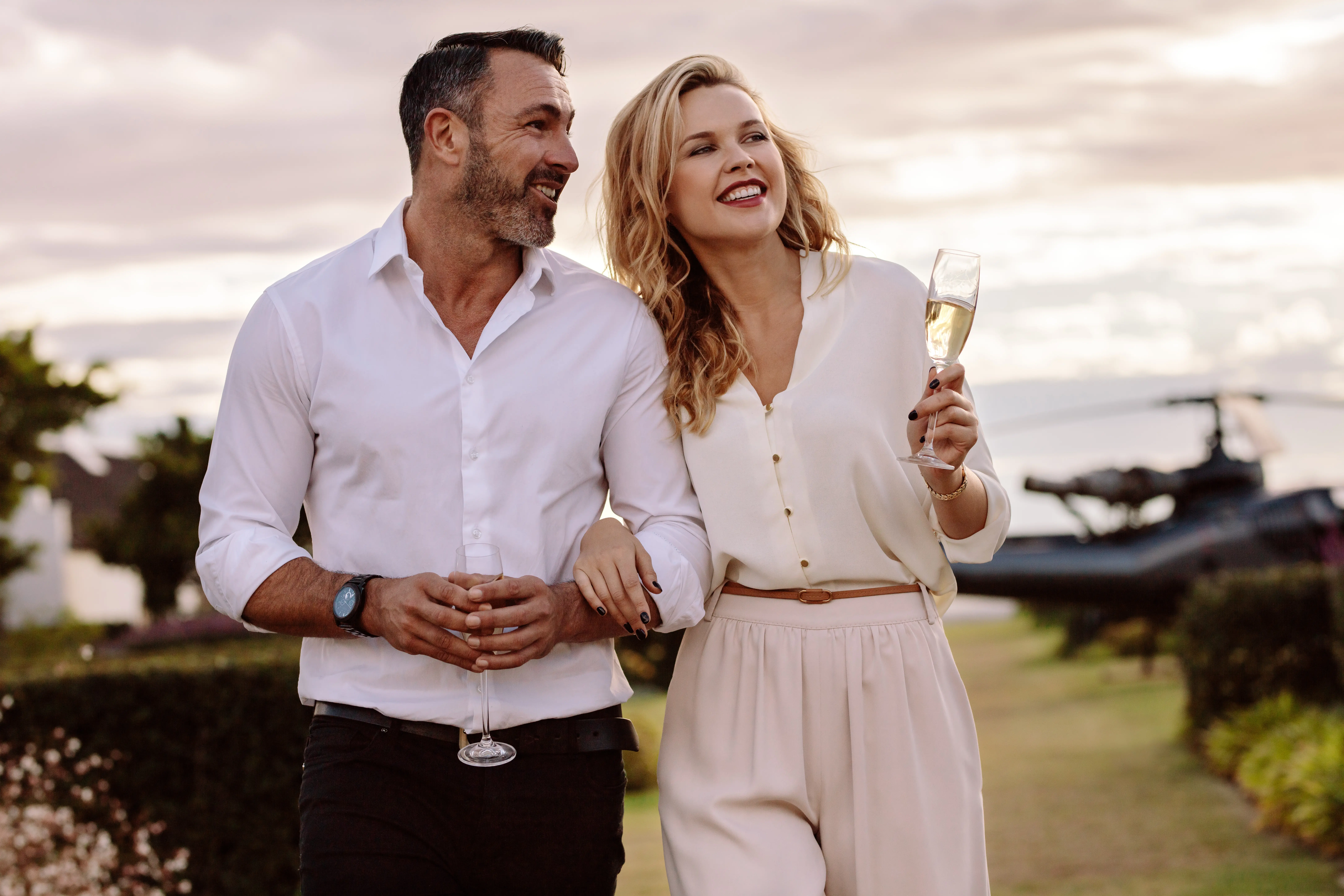 A man and a woman holding wine glasses.