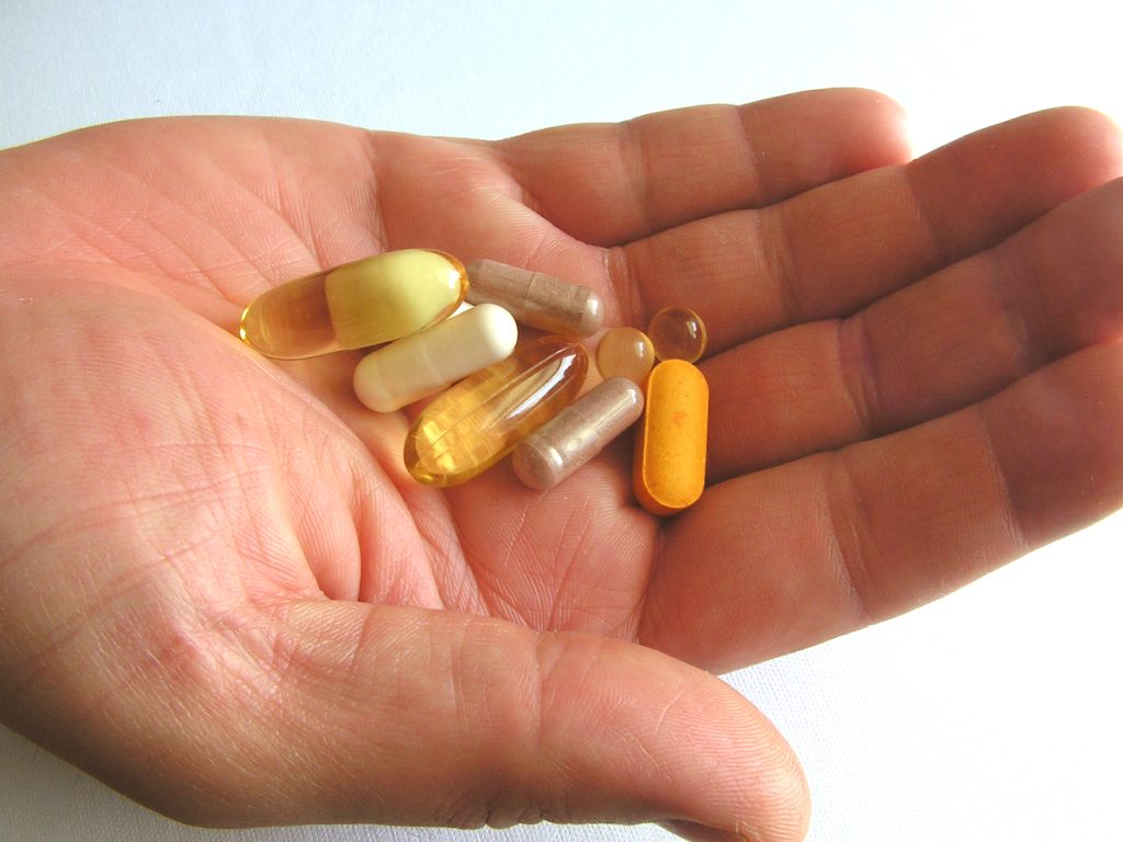 Hand holding generic medications