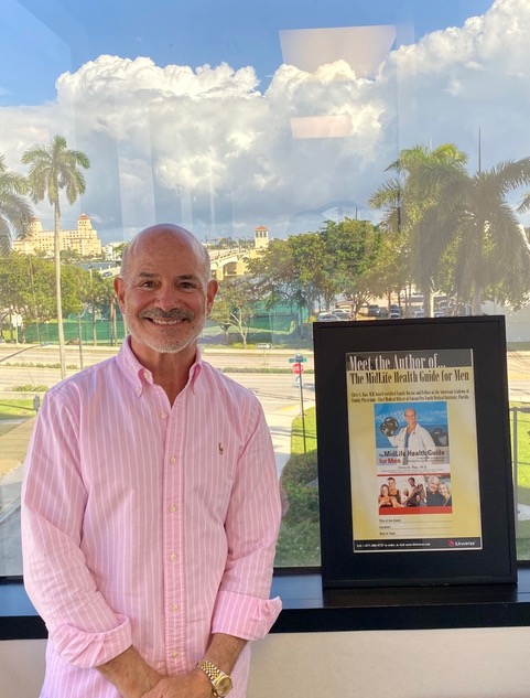 Dr. Rao showcasing his book The MidLife Health Guide for Women about post-menopausal weight loss