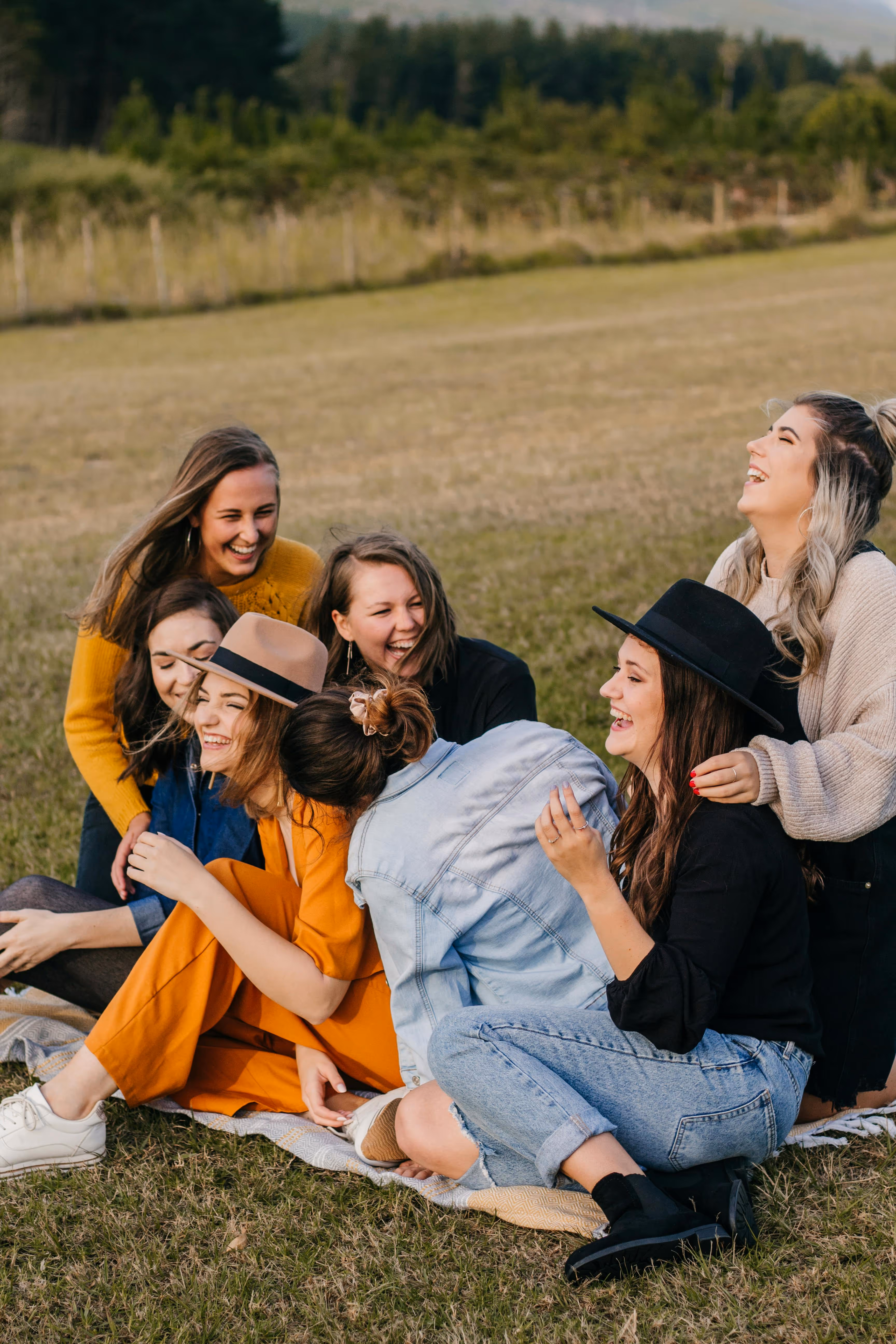 Friends sitting on grass stock image