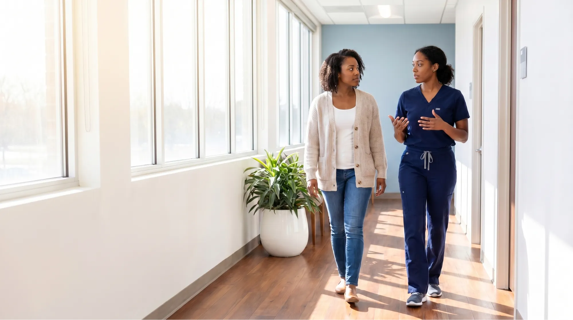 Mother holding child while being seen by a nurse at AllCare urgent care