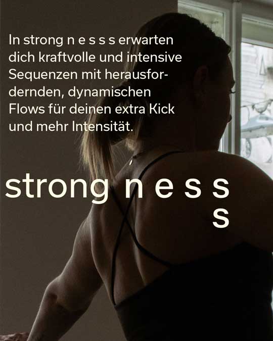 Muscular woman stretching her arm near window with German motivational text about intensity and strength for the nesss class strongnesss.