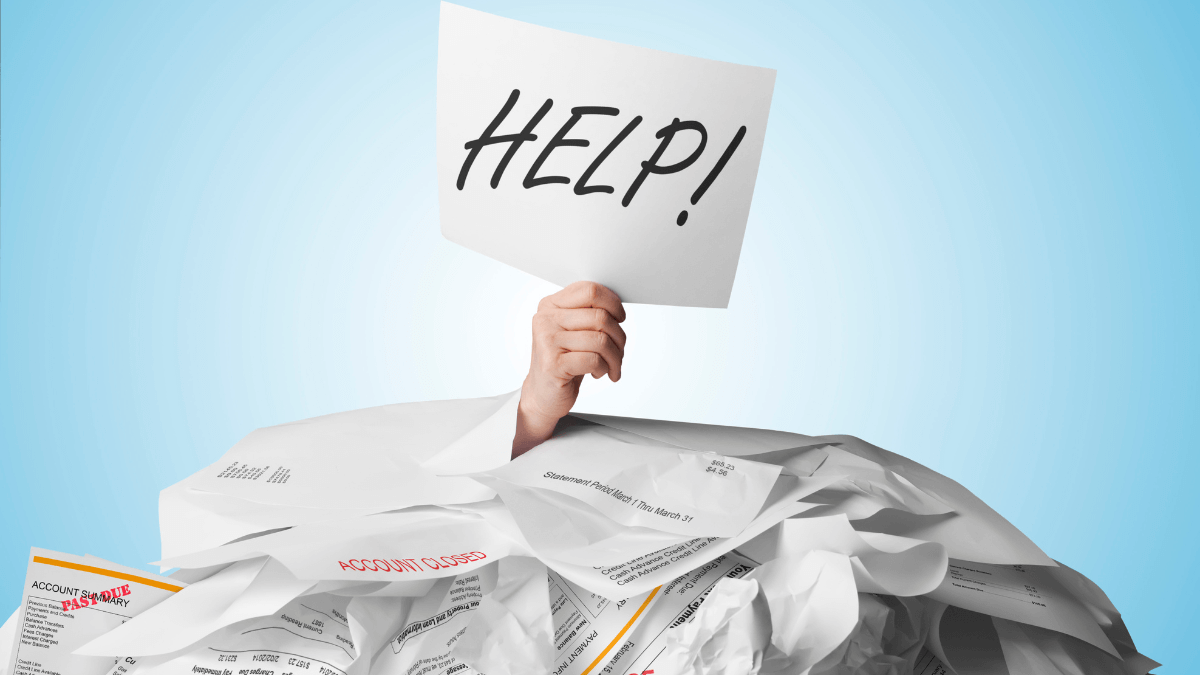 A person's hand holding a paper with text saying Help while being flooded with account dues and receipts