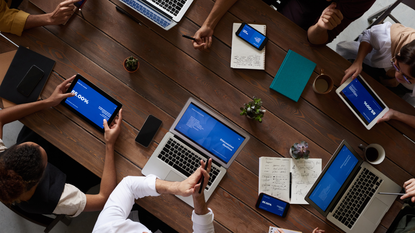 A group of employees having a meeting and working together