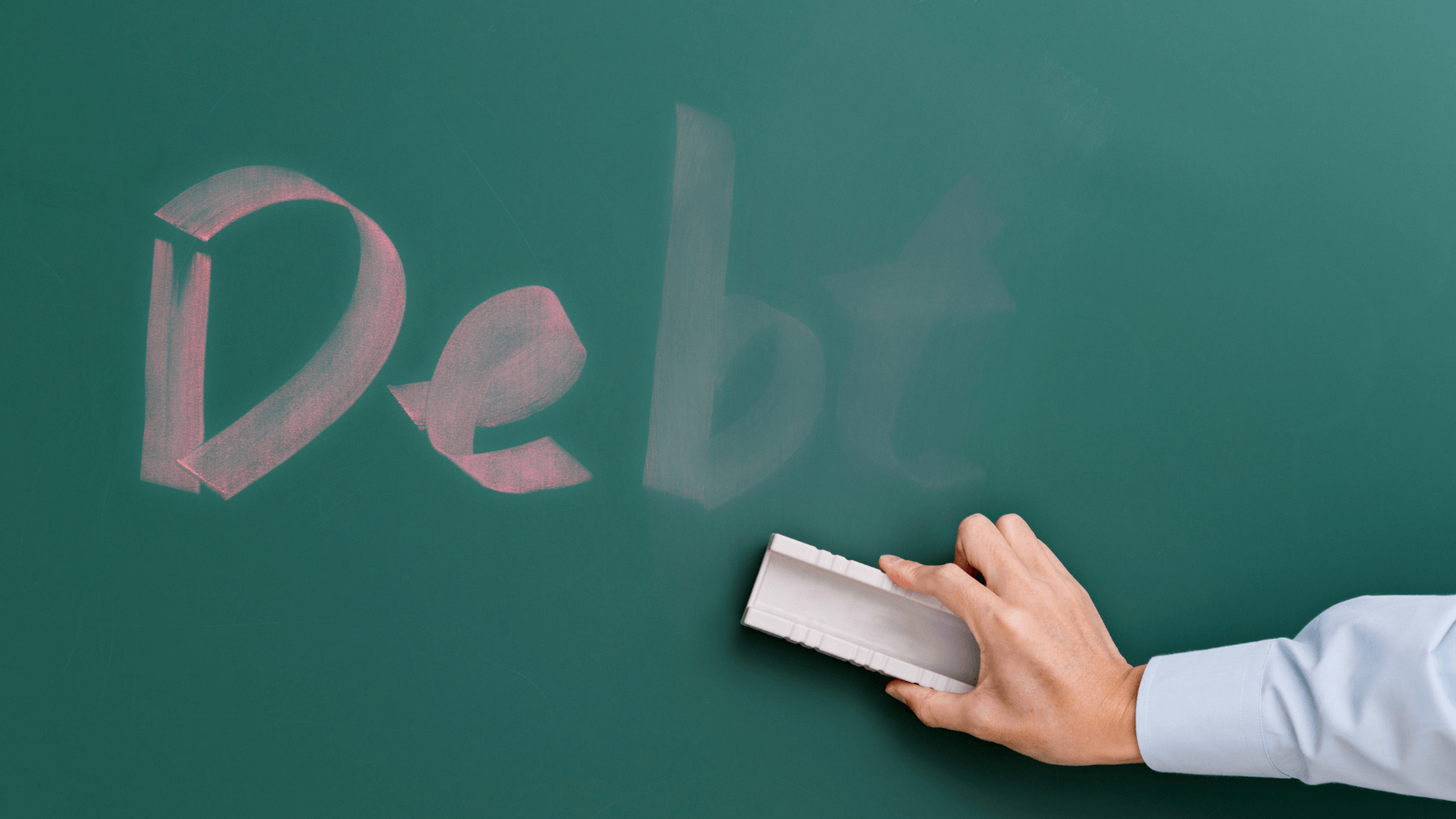 A person trying to erase the word debt on the blackboard