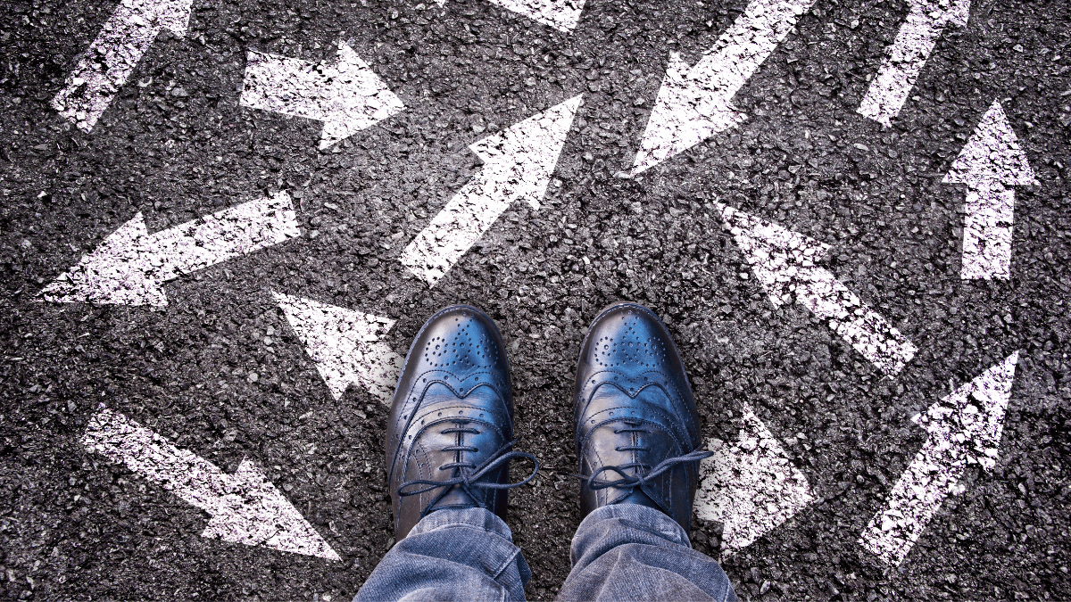 A person shoes with different arrows and directions on the floor