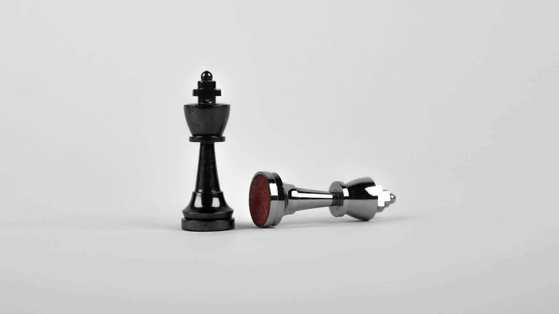 An image showing two chess piece on a plain white background