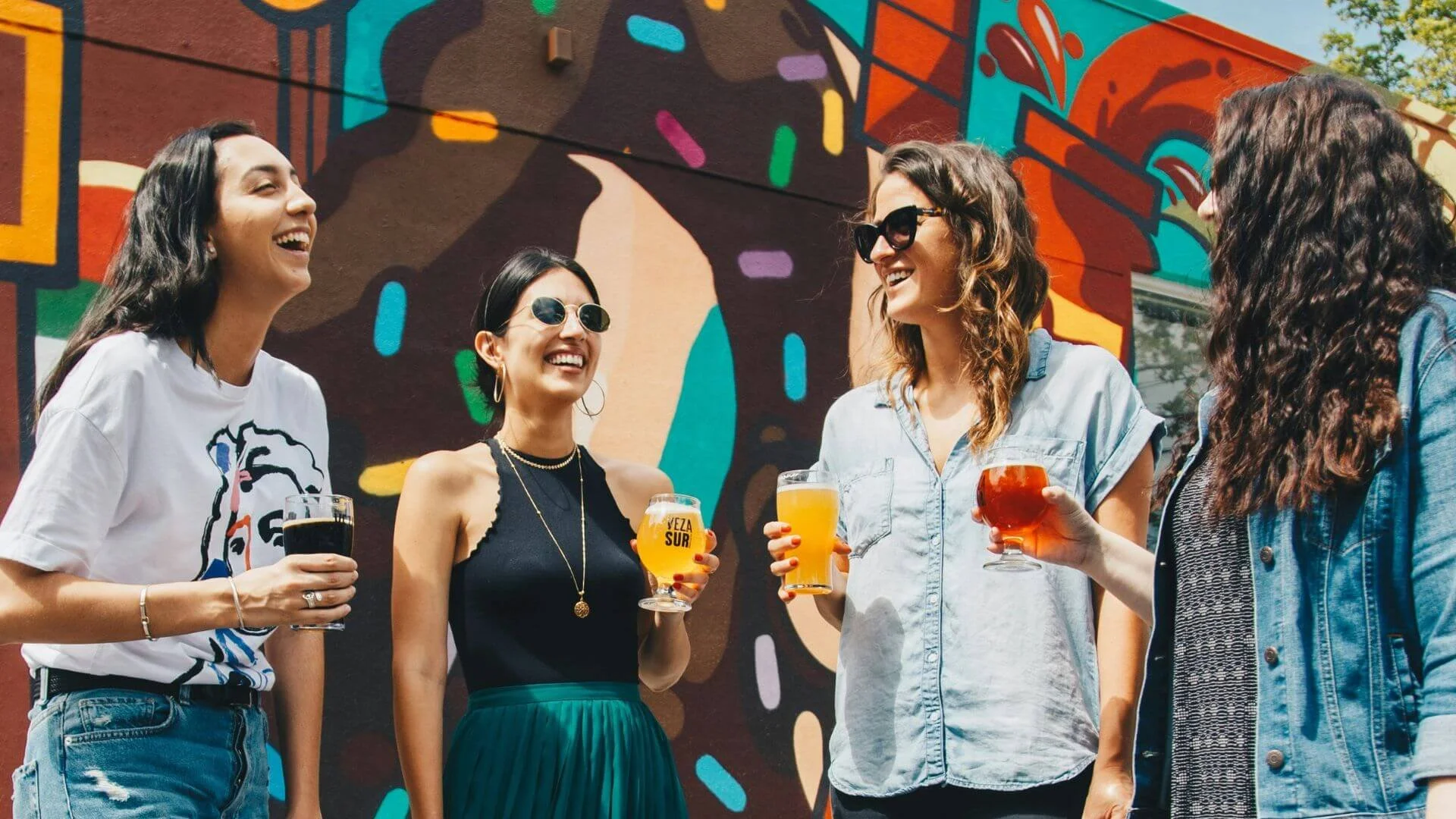 Four people enjoying their cold drink