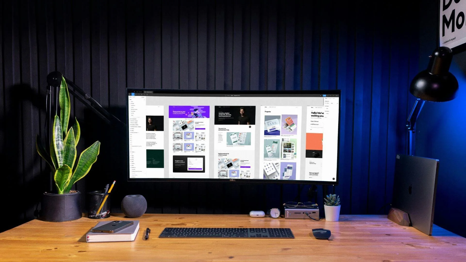 A computer monitor showing edited flyers and infographics