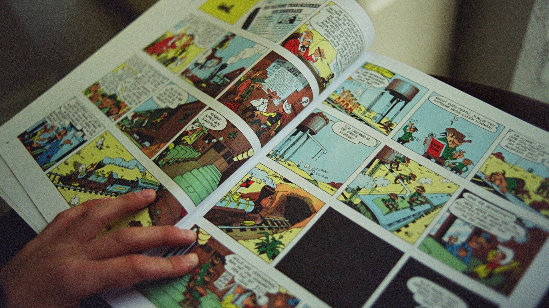 Person holding a comic book