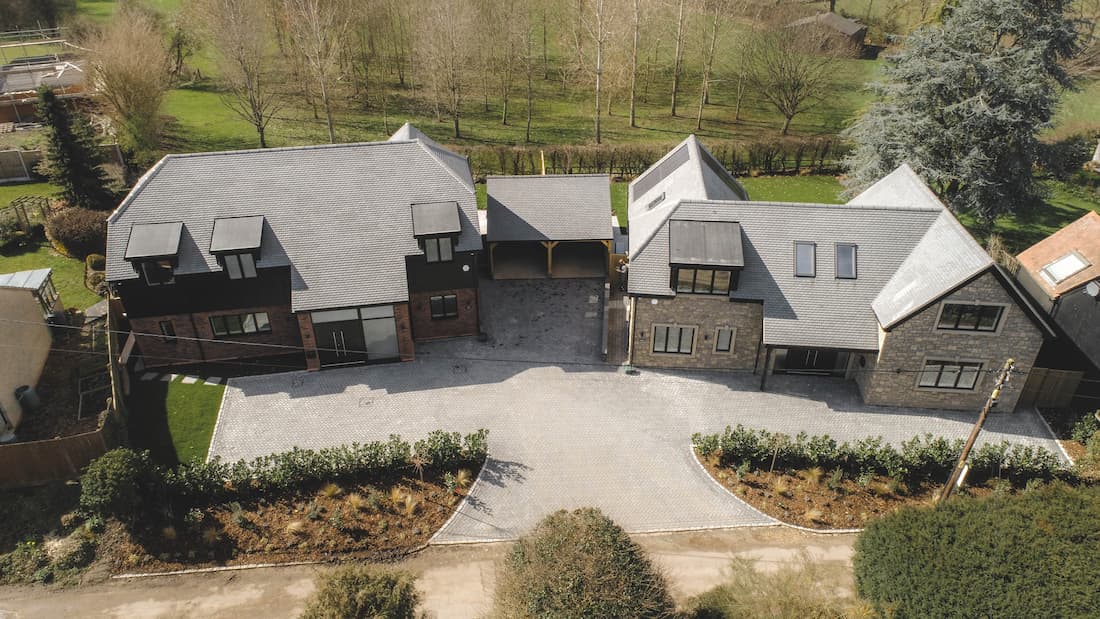 Cat Lane: Two luxury homes set in a picturesque location, featuring elegant period design and landscaped surroundings