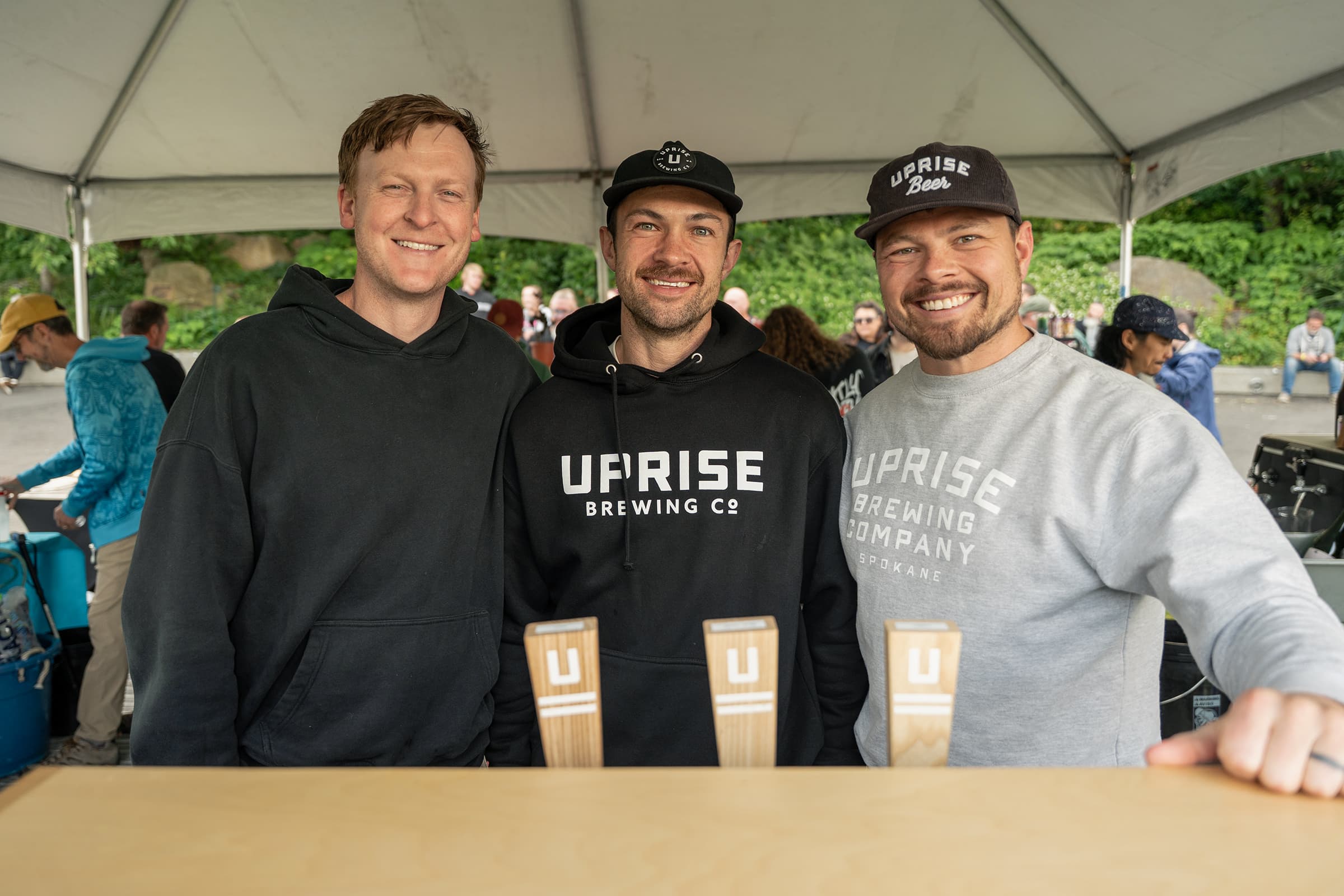 Group of brewers posing with tap handles at Washington Brewers Fest