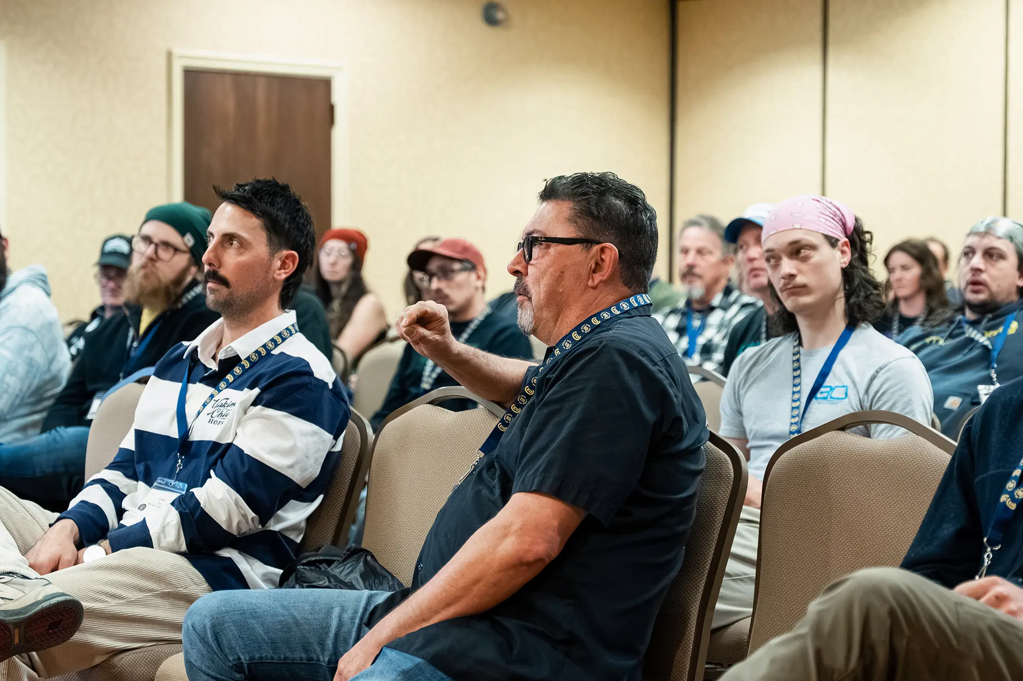 Attendees seated and listening during summit presentation