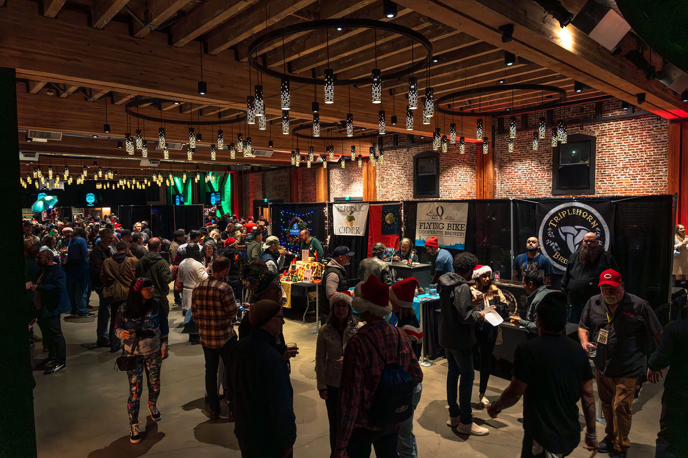 Crowded interior of Washington Winter Beer Fest 2025 with attendees gathering inside a brewery event hall