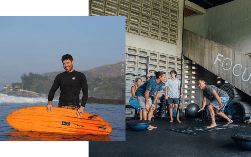 Man smiling waist-deep in water holding an orange surfboard with a coastal landscape in the background, alongside a group of four people exercising indoors using fitness equipment.