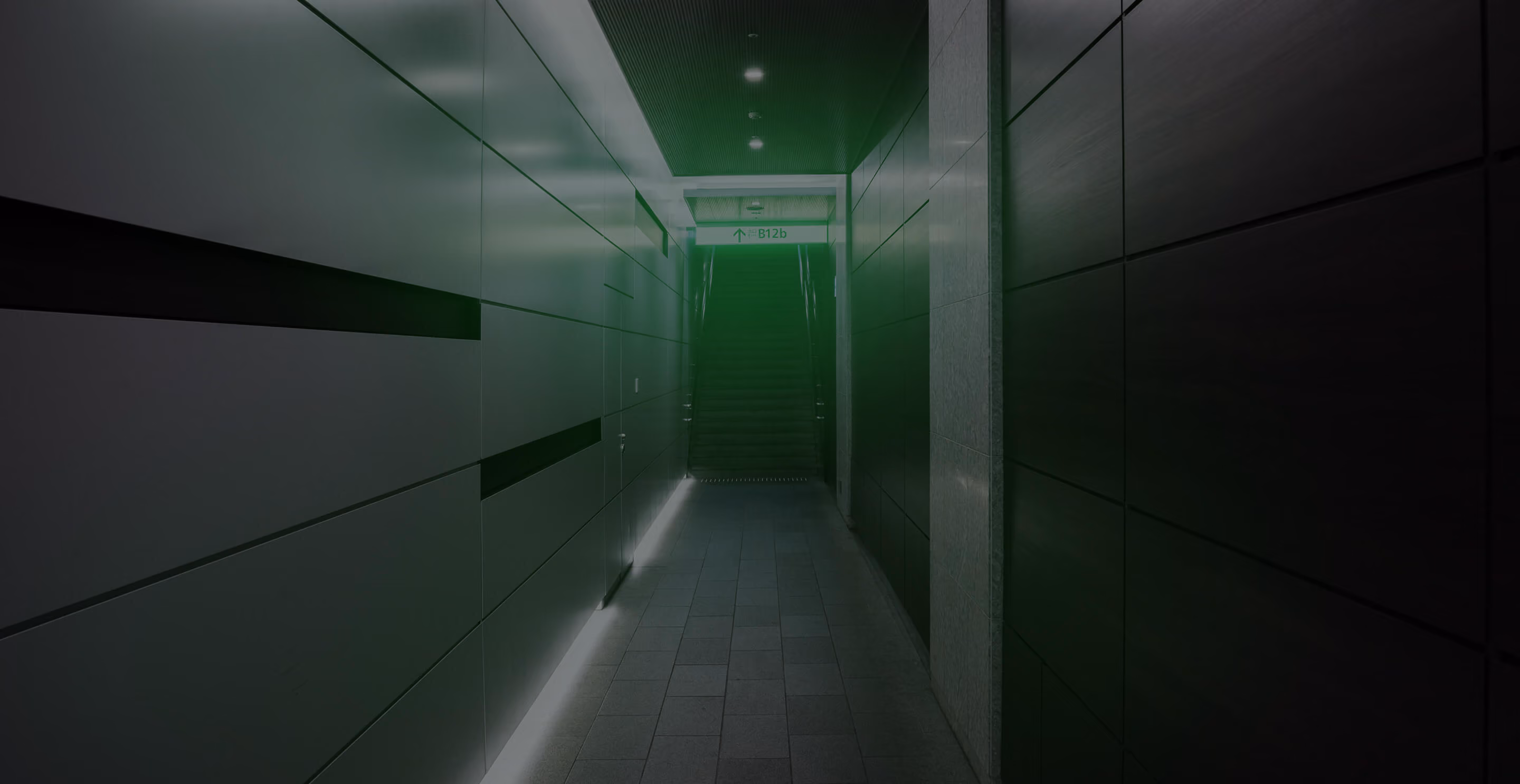Secure data center corridor lit in green